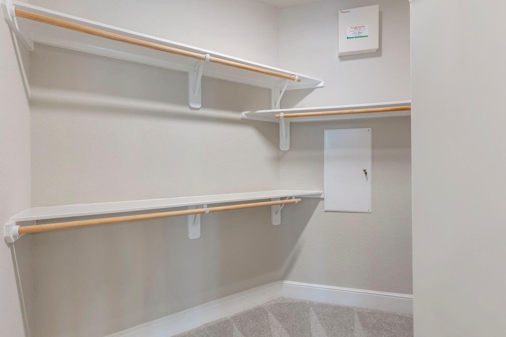 Primary walk-in closet.