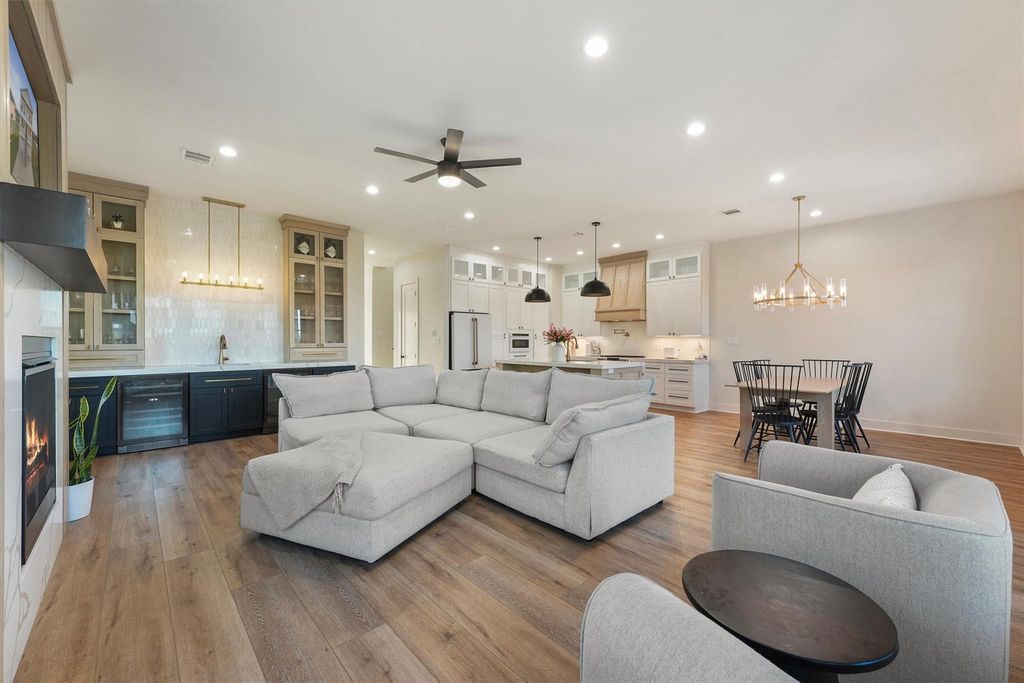 Open gathering space connecting to the gourmet kitchen and dining, ideal for entertaining.