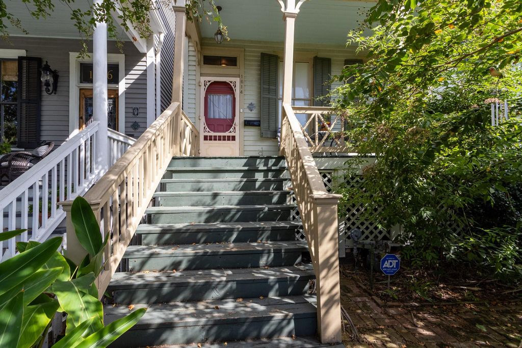 Circa 1886, this East End cottage has good fortune of having shrubbery for privacy. Raised house with storage below. Front brick patio to the right. 