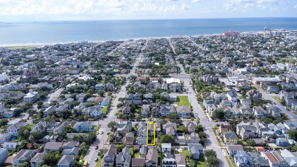 Southerly aerial view of highlighted 1614 Ball with the Seawall and the Gulf of Mexico in the background.