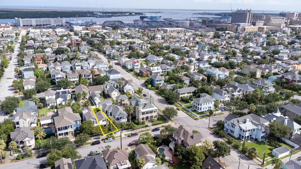 Northerly aerial view of highlighted 1614 Ball with Royal Caribbean Cruise Terminal and UTMB in far right background. Located in the East End Historical District, the entire district is on the National Register of Historic Places.