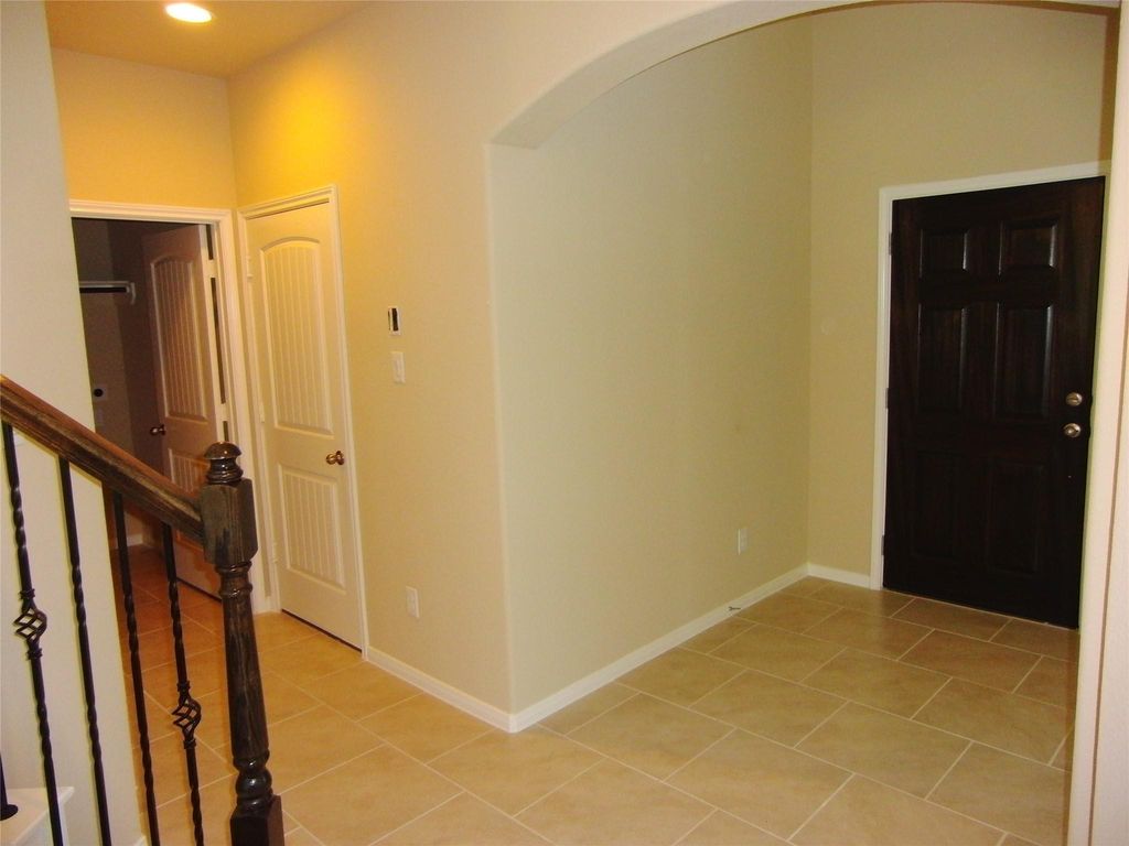 Convenient access to the utility room, half bathroom, and spacious garage.