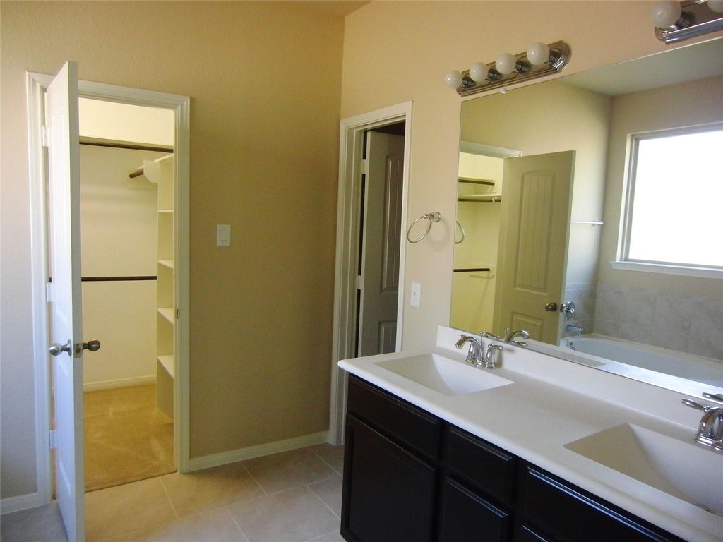 Master bathroom with an adjoining walk-in closet for ultimate convenience.