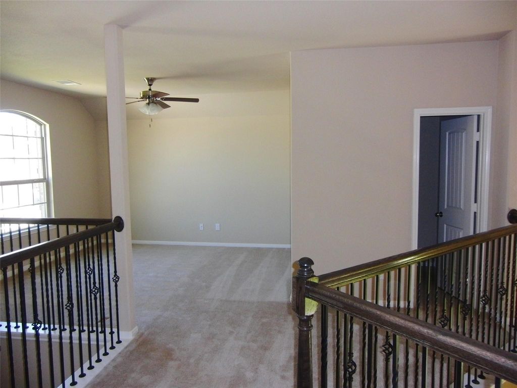 Bright and inviting game room with a full bathroom.