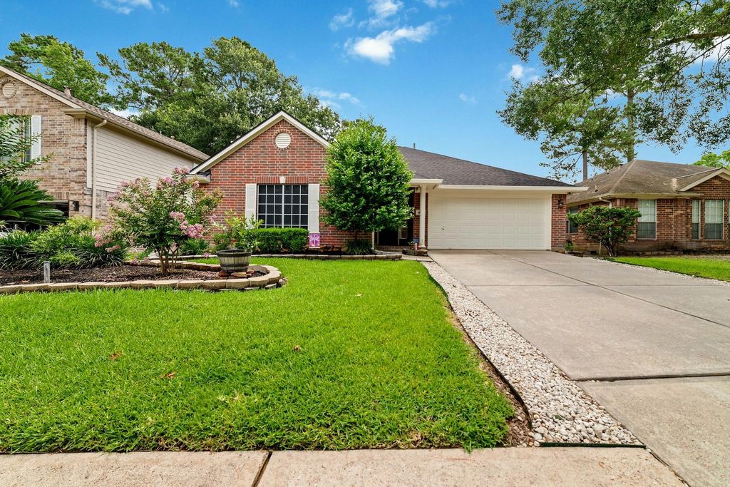 Proudly set back with a long driveway, lush landscaping, and vibrant flower beds, this home offers stunning curb appeal and a pristine, welcoming presence.