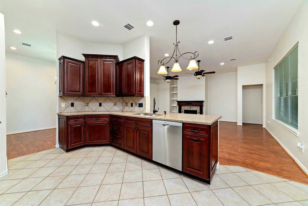 Become the host of the night with a kitchen that connects seamlessly to the breakfast area, bar, family room, and dining room—offering the perfect flow for effortless entertaining and everyday living.