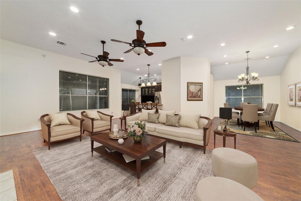 Virtually staged to highlight the open and airy layout. From this vantage point, you can fully appreciate the seamless flow and generous proportions that make this home perfect for both relaxing and entertaining. Natural light fills the room, creating an inviting ambiance that truly brings the living area to life.
