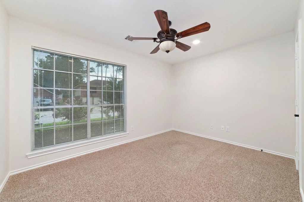 This spacious secondary room is enhanced by a large window that floods the space with natural light, creating a bright and inviting atmosphere. Thoughtfully designed for convenience, it is ideally situated near the secondary bathroom, ensuring easy access and added comfort for residents or guests.