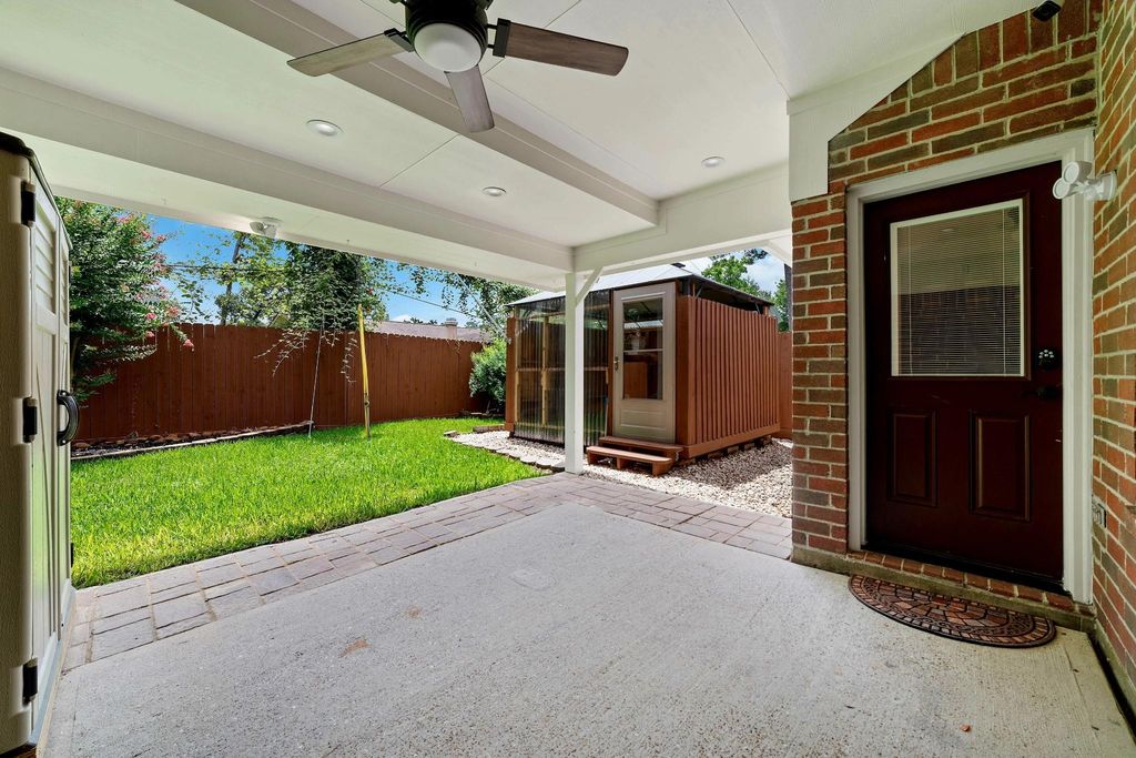 A beautifully covered backyard patio designed to enhance outdoor living, providing a comfortable and elegant space for relaxation, entertaining, and enjoying leisurely activities year-round.
