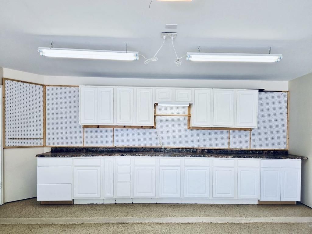 The built-in cabinets are perfect for organizing tools, seasonal décor, car supplies, and more. A savvy storage upgrade for every lifestyle!