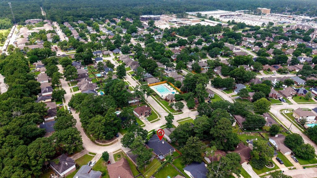 From this elevated vantage point, take in sweeping views that capture the lush greenery, vibrant community spaces, nearby schools, and expansive parks—all beautifully woven into the landscape.