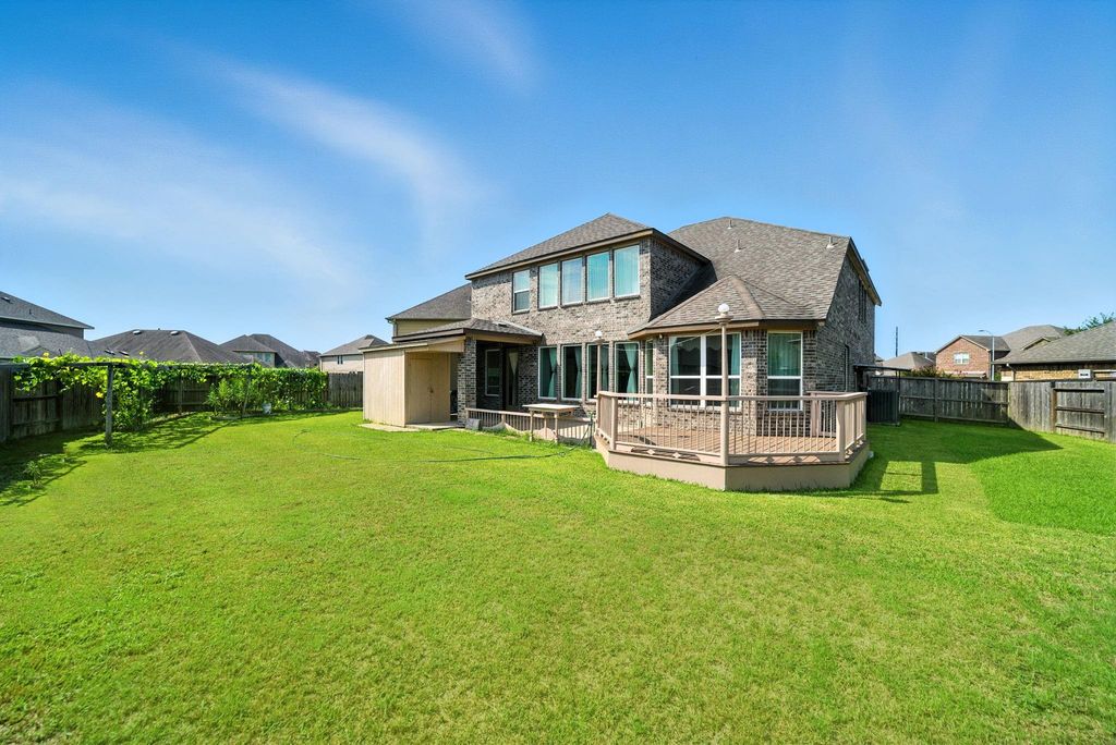 Spacious two-story brick home with a large, well-maintained backyard. Features a deck perfect for outdoor gatherings and a fenced perimeter for privacy. Ideal for families seeking outdoor space.