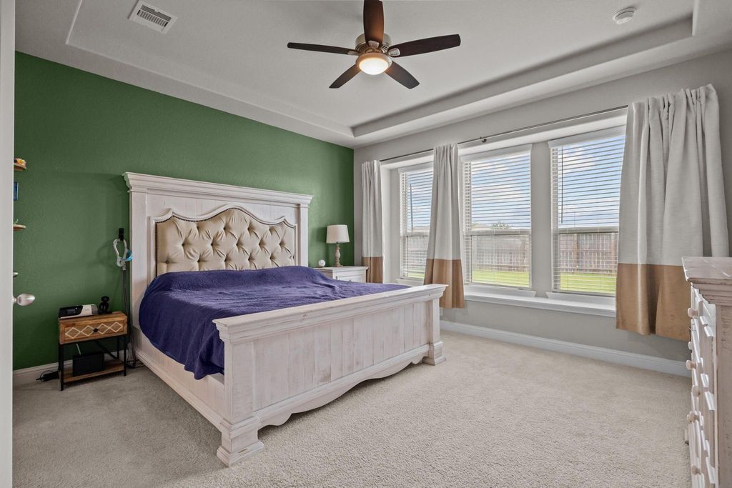 Relaxing primary bedroom featuring a cozy window bench
