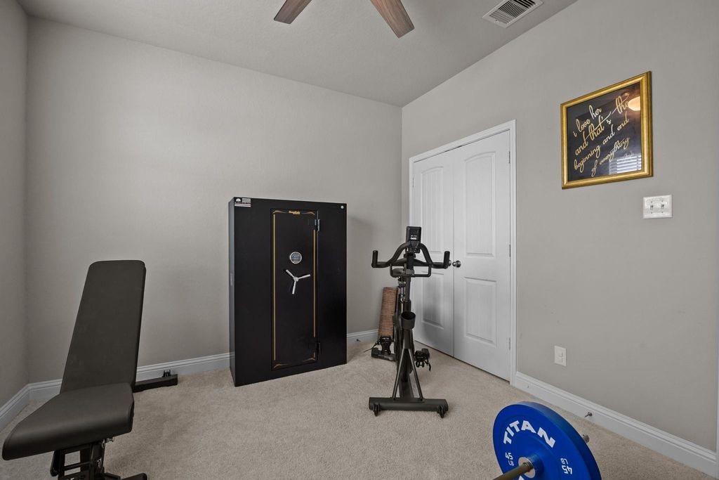 One of two spacious secondary bedrooms on the main level