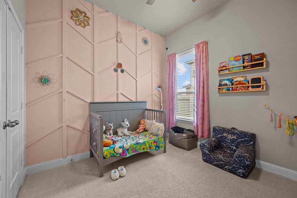 First-floor bedroom with stylish custom accent wall