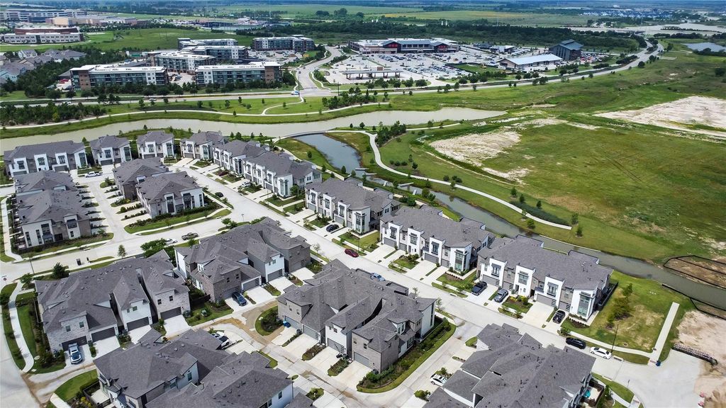 View toward the new HEB and surrounding meandering lakes. This is Bridgeland Central, highly anticipated and within a top selling master planned community in Cypress.