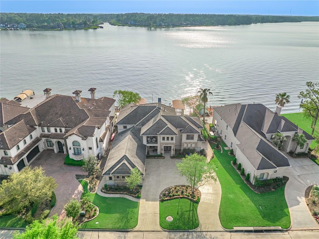 This remarkable 4 bedroom, 4 ensuite bath spans approximately 5,839 square feet and showcases a plethora of luxurious amenities and finishes. 