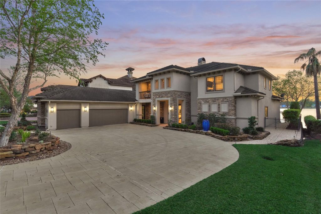 Drive up to a 3-car garage that features built-in cabinets throughout and has a climate controlled workshop with cabinets, butcherblock countertops and peg board throughout. 