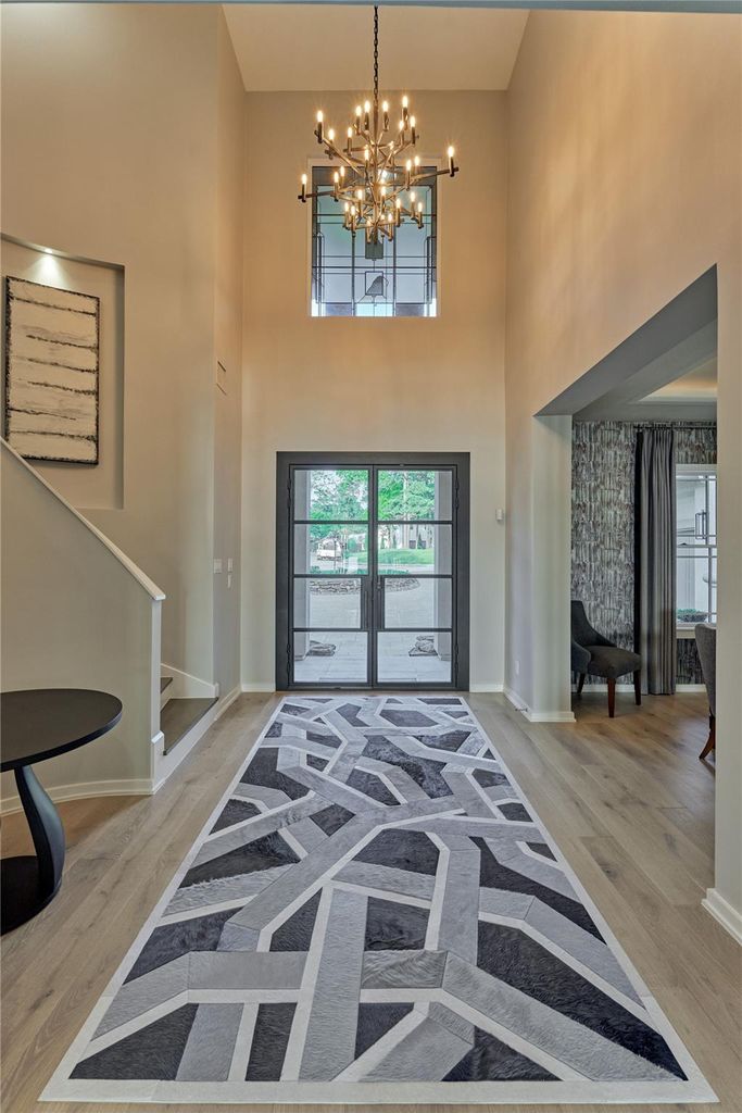 A magnificent chandelier sets the tone for this truly amazing home and rich wood flooring continues throughout the entire first floor.  
