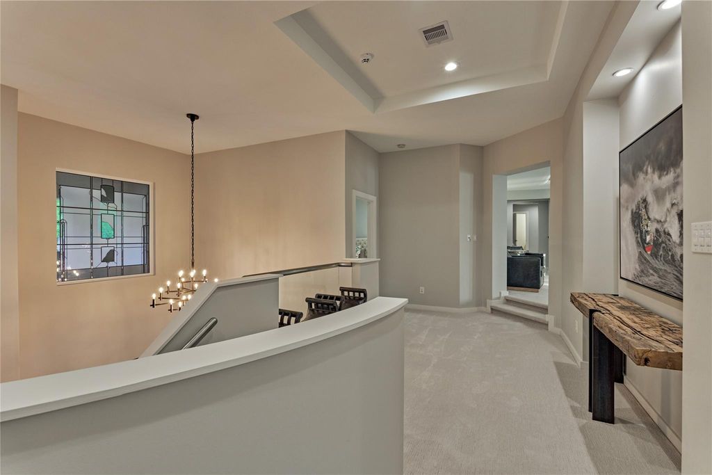 On the second floor there are 3 guest suites, a media room with a half bath and a game room with access to the balcony. 